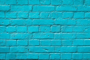 Painted brick wall, blue color, urban background. Horizontal texture. For abstract backdrop, pattern, wallpaper or banner design