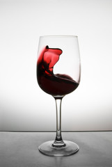 Wine splashing in glass