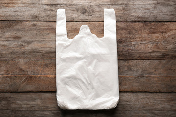 Clear disposable plastic bags on wooden background