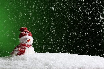 Decorative snowman on color background, space for text. Winter weather