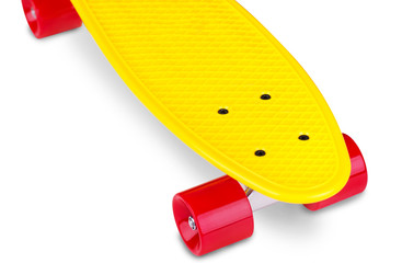Yellow cruiser penny plastboard with red wheels isolated on white background