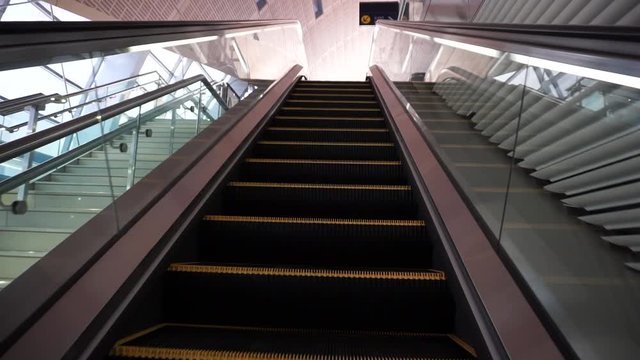 escalator mobing up at an airport