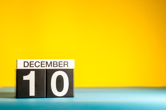 December 10th. Image 10 day of december month, calendar on yellow background with empty space for text