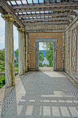 Yonkers, New York, USA: A doorway in the loggia of the Walled Garden leads to the Vista and a view of the Hudson River at Untermyer Park and Gardens.