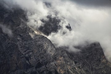 Mountain Wall Obscured By Clouds