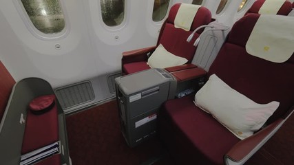 Medium shot of a jet airplane interior view without people seated inside the cabin 3