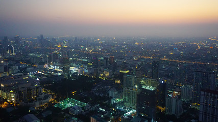 Panorama of the night of Bangkok from a height of a skyscraper. Thailand