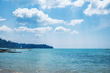 Lighthouse on the horizon, the waters of the Andaman sea at sunset, Nang Thong Beach, Khao Lak, Thailand