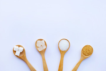 Various types of sugar on white.