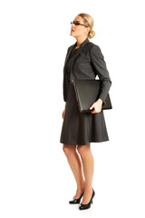 Fototapeta premium Businesswoman standing and holding a laptop