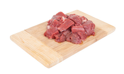 fresh meat on a wooden cutting board isolated on white background