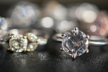 Jewelry diamond rings set on black background close up