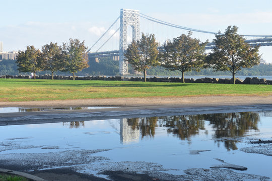 George Washington Bridge Reflected In Rain Puddles At Ross Dock Picnic Area, Fort Lee, NJ