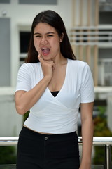 Fototapeta premium Young Asian Adult Female With Toothache
