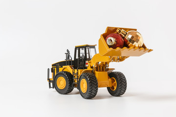 Christmas ornament and Wheel Loader model , Holiday celebration concept new year on white background