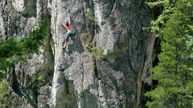 Confident female climber rock climbing Squamish Valley Canada