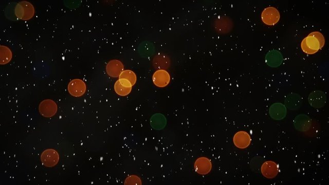 Video composition with snow over blurry colorful lights