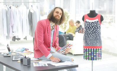 portrait of a fashionable tailor in a modern Studio