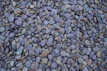 Seaside rocke, stones, and pebbles worn smooth by the surf