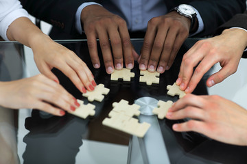 closeup.business partners accounting for the puzzle pieces