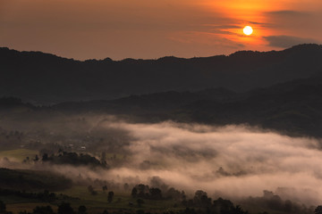 View of covered in foggy during morning sunrise.