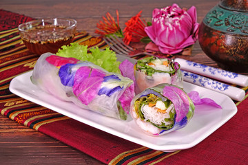 Spring rolls : Edible flowers spring rolls. Beautiful and delicious Thai cuisine. Colorful appitizers made from edible flowers, shrimps, rice noodle and organic vegetables wrapped with rice paper.