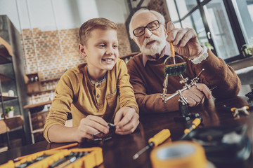 Happy boy dreaming about robot