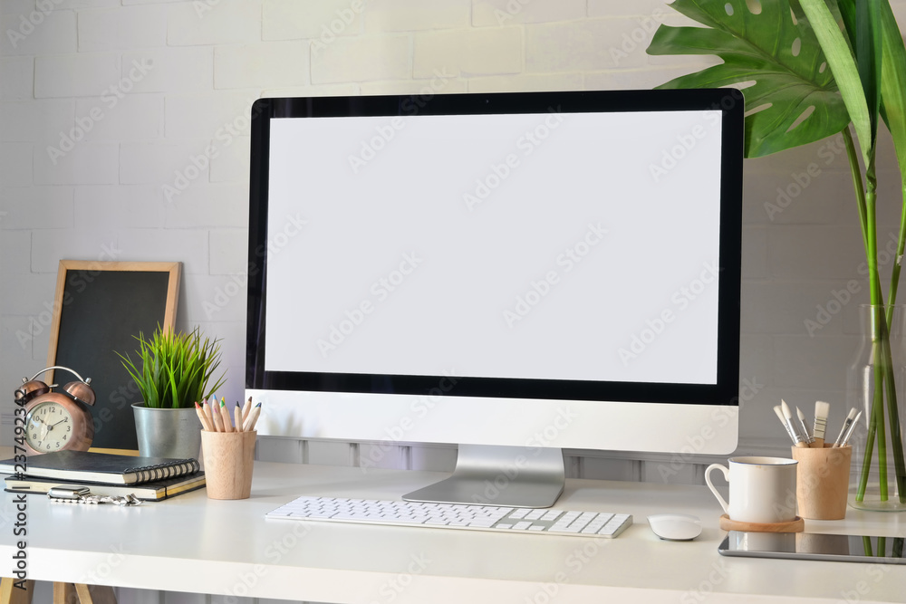 Sticker mockup modern blank screen desktop computer on stylish workspace.