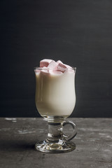 Hot sweet milk with pink marshmallows. Selective focus. Shallow depth of field.