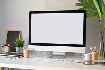 Mockup modern blank screen desktop computer on stylish workspace.