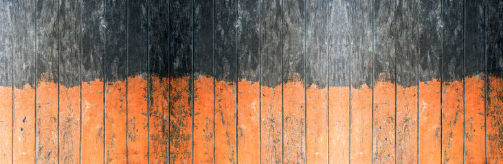 Vintage orange and black color painted wood wall as background or texture, Natural pattern. Blank copy space.
