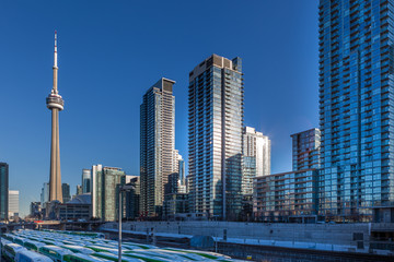 Fototapeta na wymiar Toronto, Canada – December 4th 2018 tall apartment skyscrapers above Toronto under the blue skies