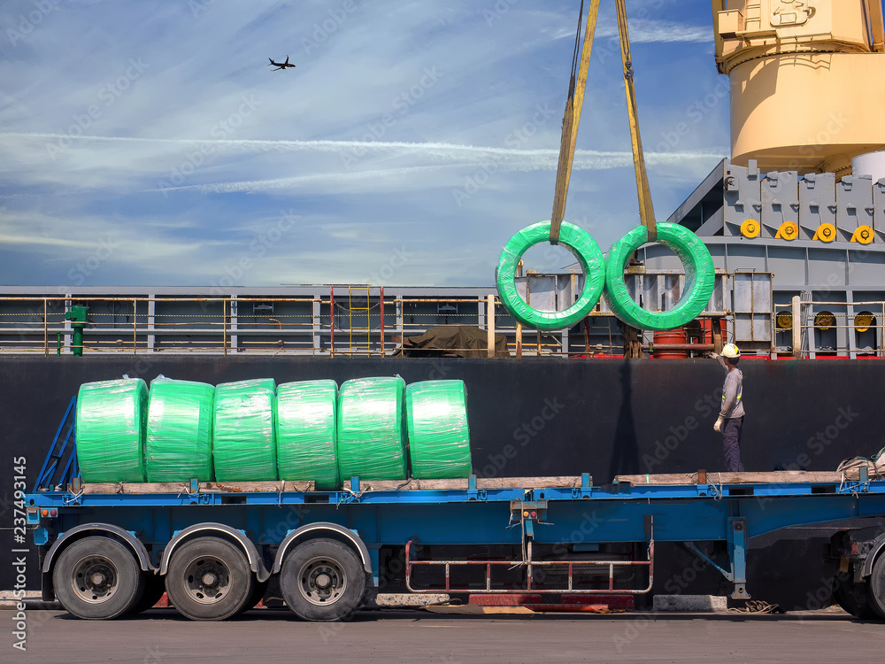 Sticker The vessel discharging steel wire rods on truck at industrial port of thailand.