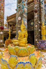 Golden statue in front of Main Pagoda in Wat Phra That Pha Son Kaew temple at Phetchabun Thailand