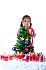 Happy asian child holding Christmas presents. Christmas or happy newyear time