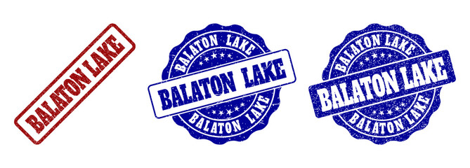 BALATON LAKE grunge stamp seals in red and blue colors. Vector BALATON LAKE watermarks with scratced texture. Graphic elements are rounded rectangles, rosettes, circles and text tags.