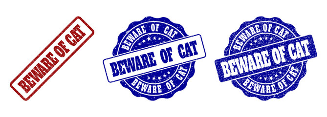 BEWARE OF CAT grunge stamp seals in red and blue colors. Vector BEWARE OF CAT signs with grunge effect. Graphic elements are rounded rectangles, rosettes, circles and text captions.
