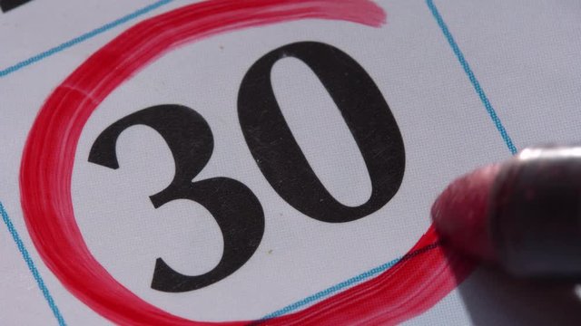 Marking the date in the calendar with a red marker. The thirtieth day of the month