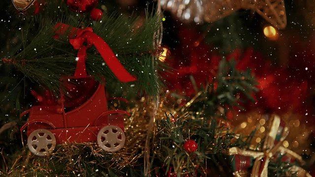 Video composition with snow over Christmas ornaments