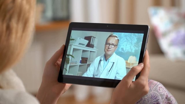 Woman talks to doctor during telehealth appointment