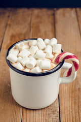 Sweet hot chocolate in mug. Christmas drink with marshmallow. Selective focus. Shallow depth of field. 