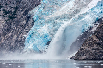 A glacier with blue ice in Kenai Fjords National Park in Alaska. 