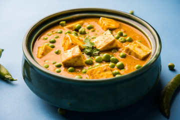 Green peas or matar paneer curry recipe, served in a bowl. selective focus