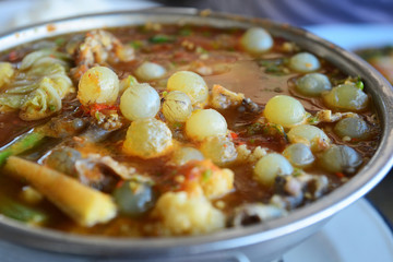 Giant sea catfish eggs with spicy  sour soup and vegetable