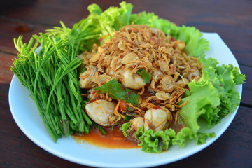 Fresh oysters with fried red onion and seafood chili sauce. Serve on green Kale leaf, Thai cuisine style,