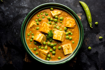 Green peas or matar paneer curry recipe, served in a bowl. selective focus