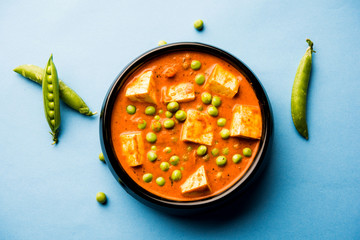 Green peas or matar paneer curry recipe, served in a bowl. selective focus - obrazy, fototapety, plakaty
