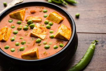Green peas or matar paneer curry recipe, served in a bowl. selective focus