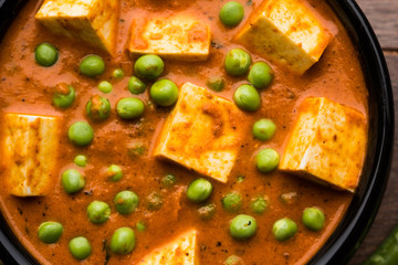 Green peas or matar paneer curry recipe, served in a bowl. selective focus
