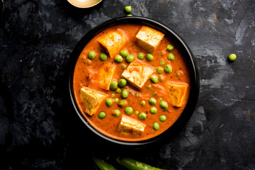 Green peas or matar paneer curry recipe, served in a bowl. selective focus